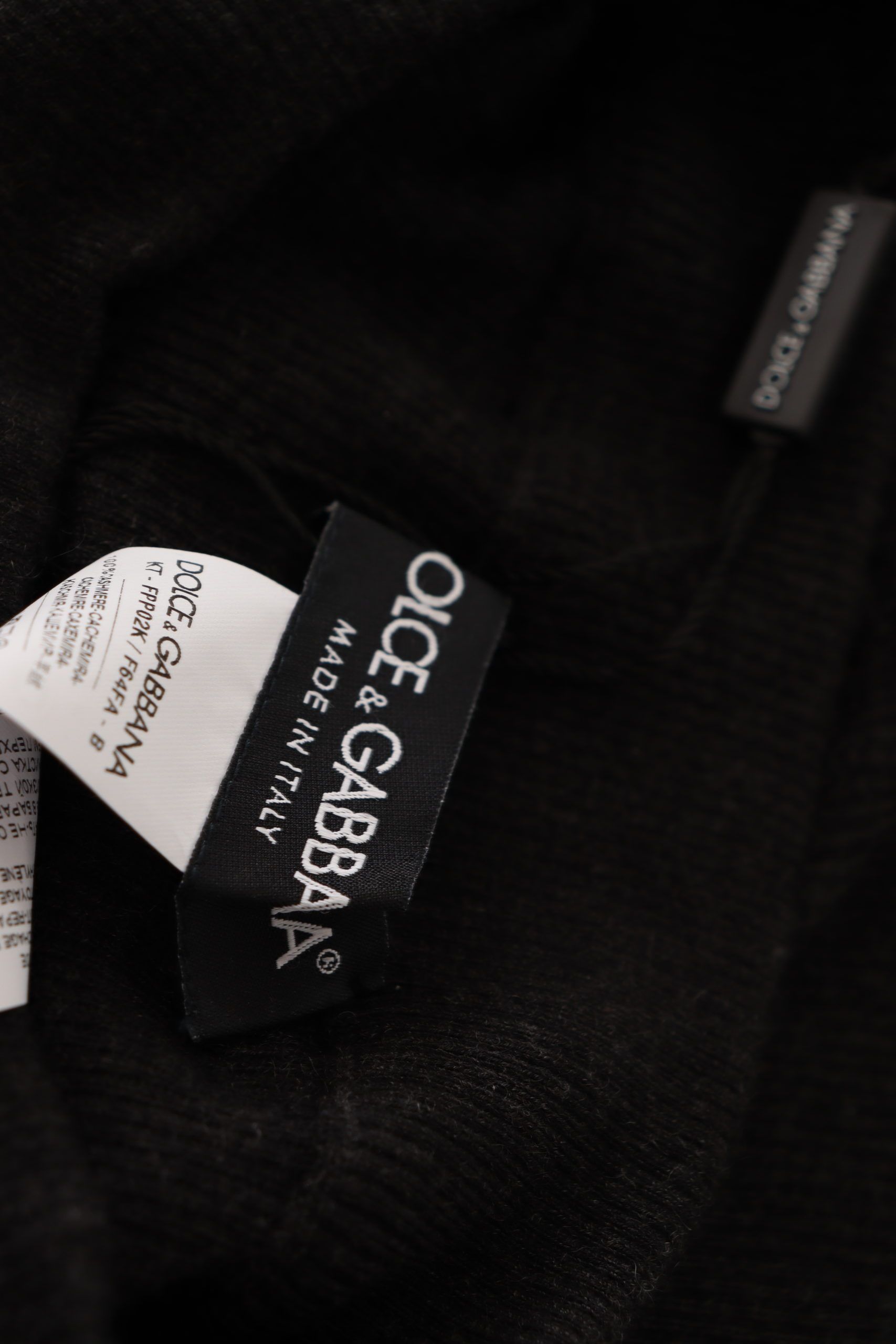 Tag on black sweater