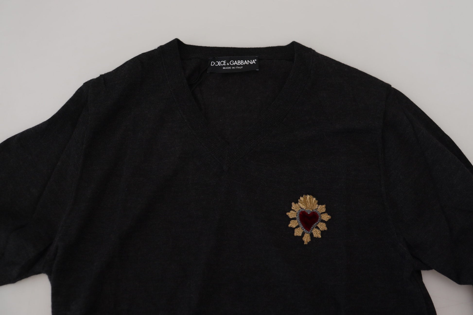 Black sweater with gold embroidery on front