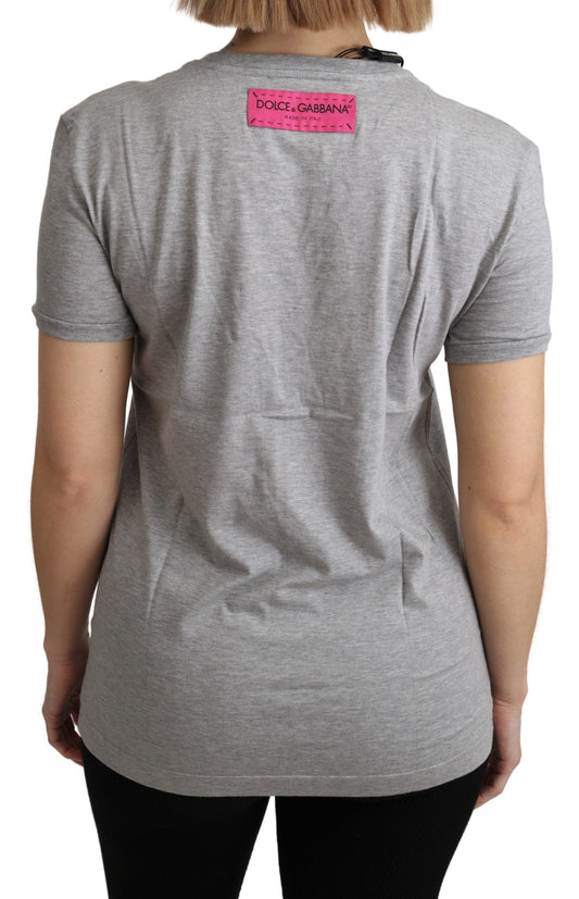 Grey short sleeved shirt with pink label on back