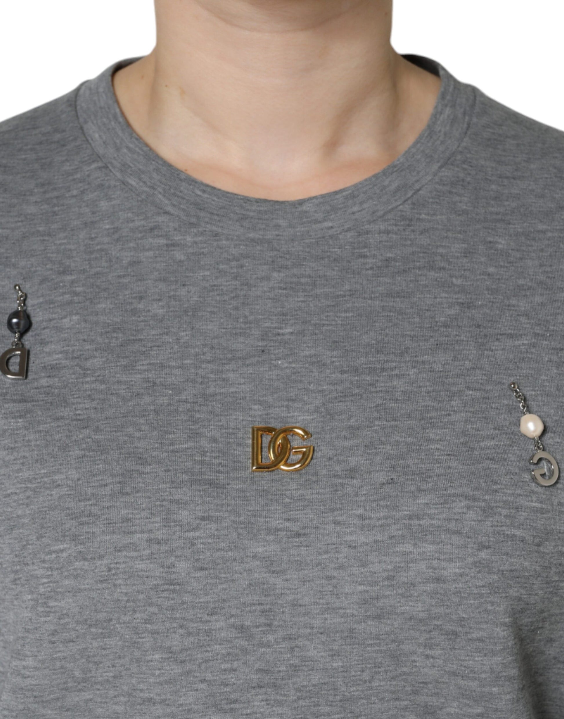 Grey sweatshirt with a small gold DG logo on the left chest area