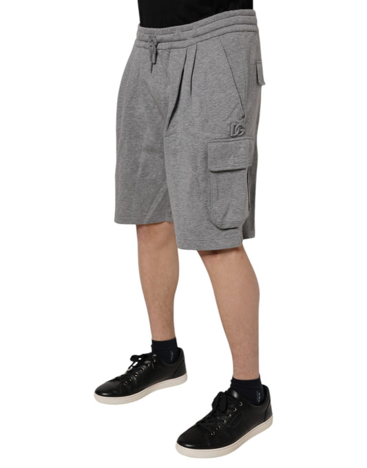 A pair of gray cotton cargo shorts with pockets on the sides. They are designed by Dolce & Gabbana and appear