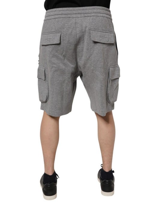 A pair of gray cotton cargo shorts with pockets on the sides