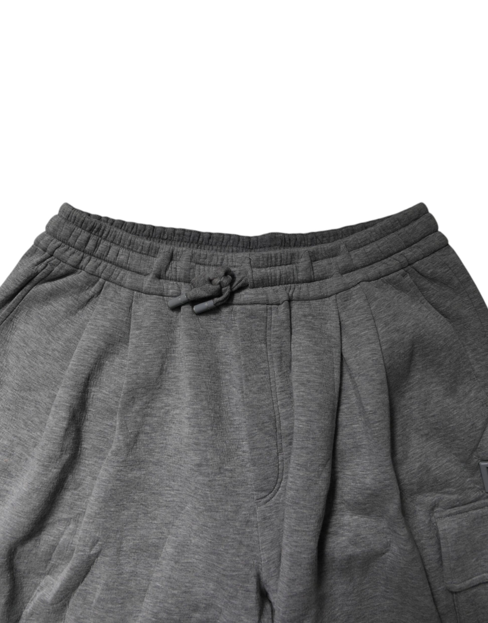 A pair of gray cotton cargo shorts with an elastic waistband. They feature two pockets on the front and are d