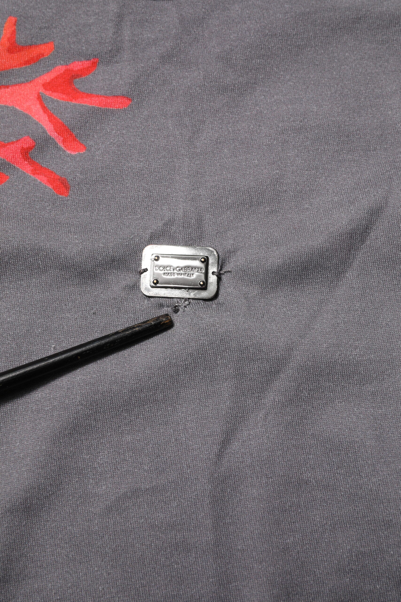 Small electronic device with a black pincer on top