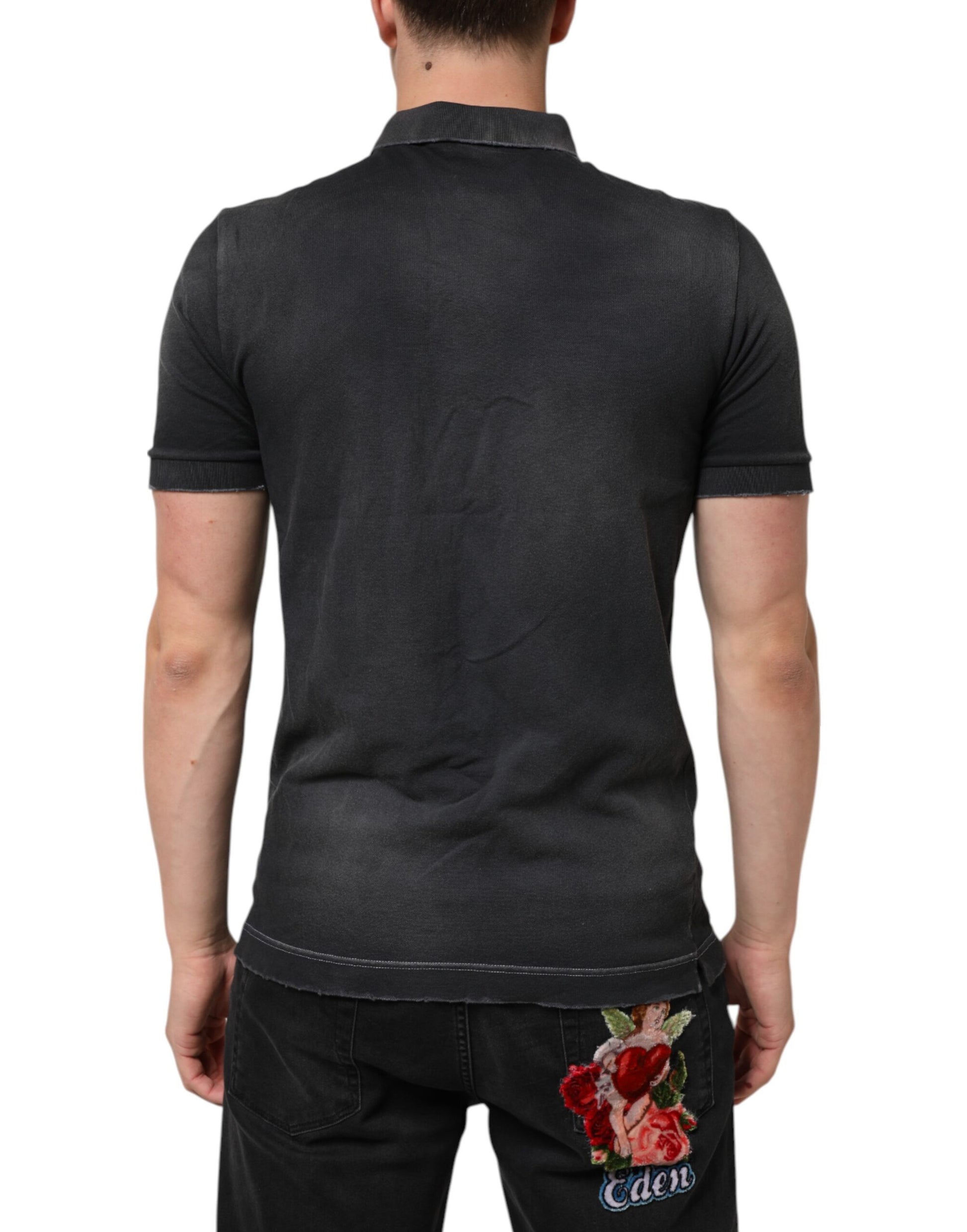 Man wearing dark polo shirt with floral design on back