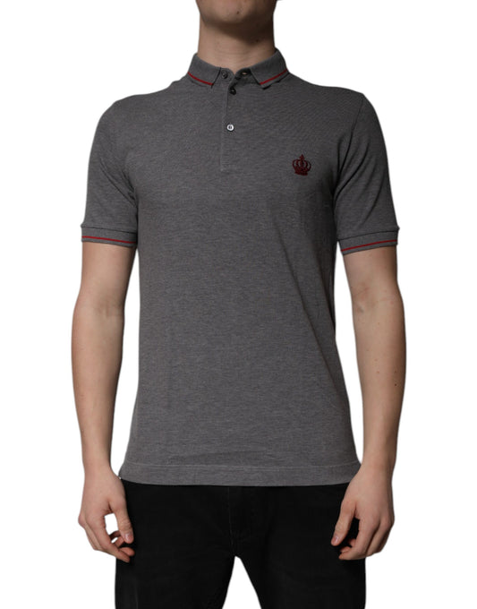 A gray polo shirt with a collar and two red stripes on the sleeves