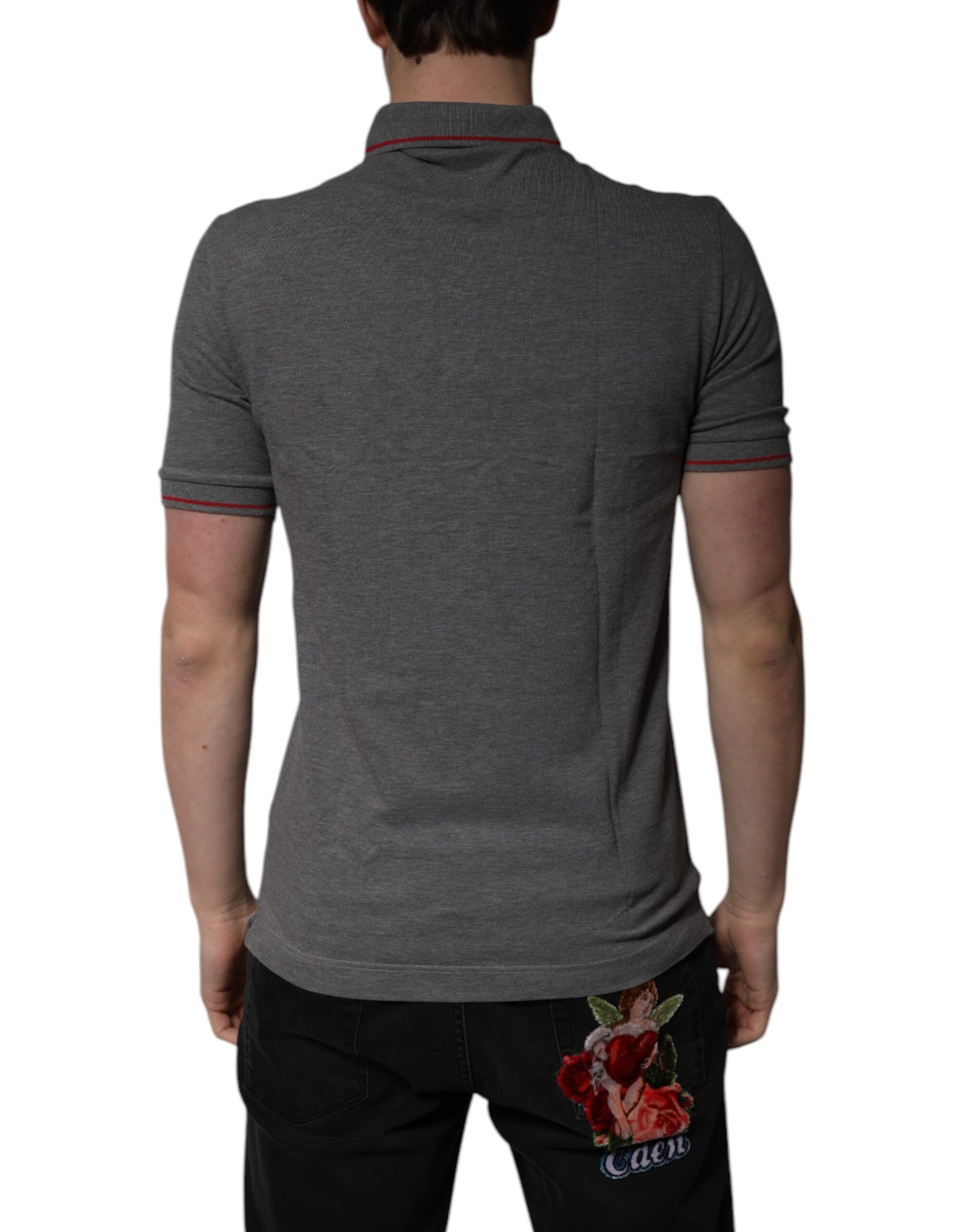 A gray polo shirt with a collar and short sleeves, featuring a small floral design on the back