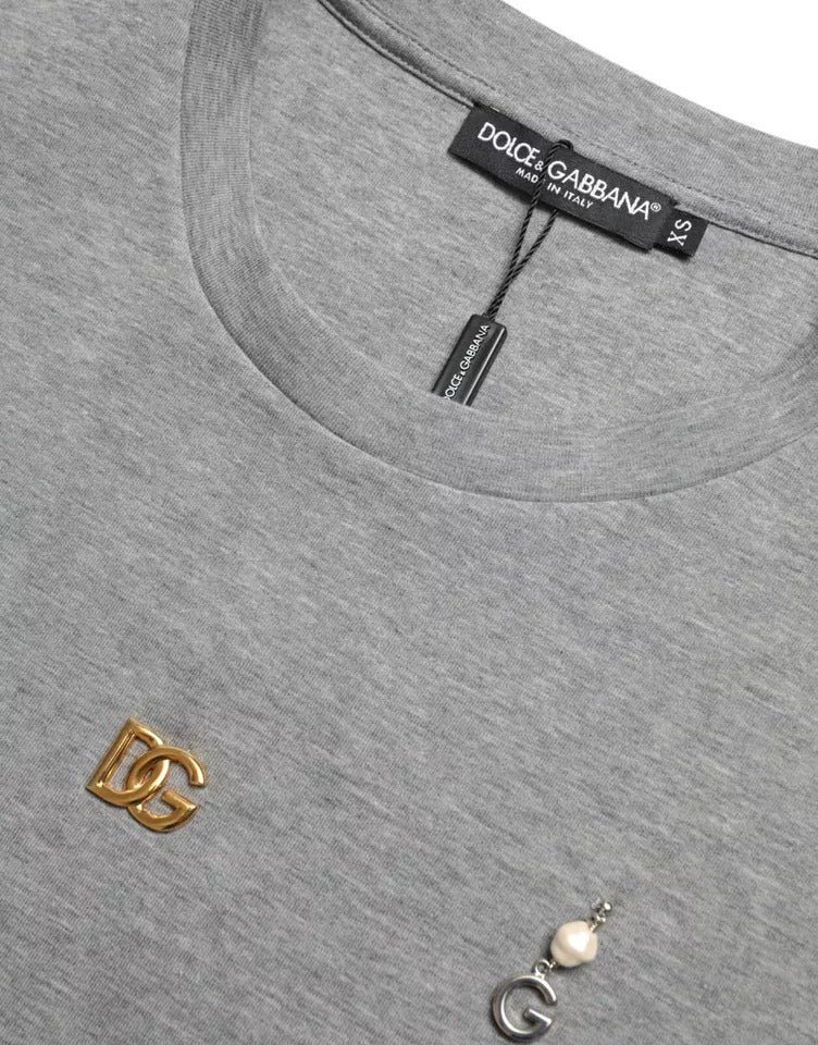 Grey shirt with gold logo on left chest