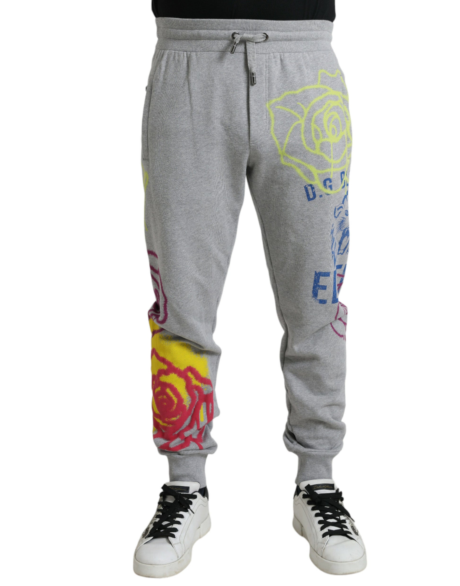 Grey sweatpants with colorful rose designs on legs