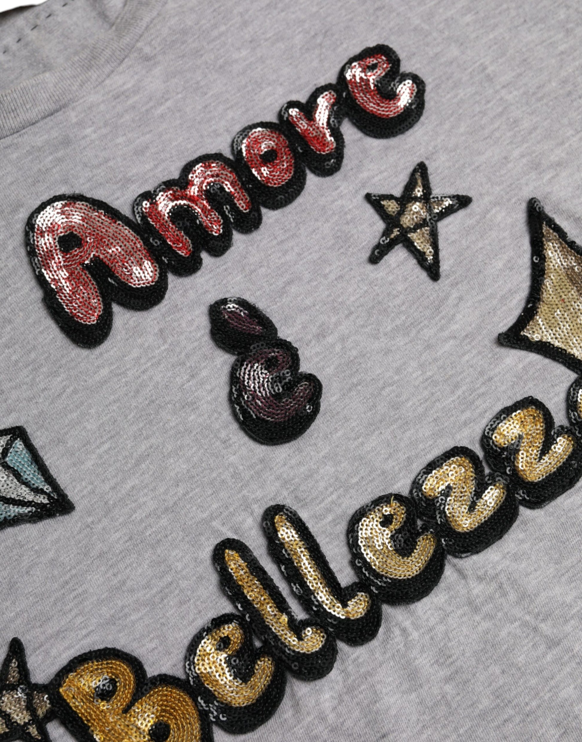 Embroidered lettering on a gray sweatshirt