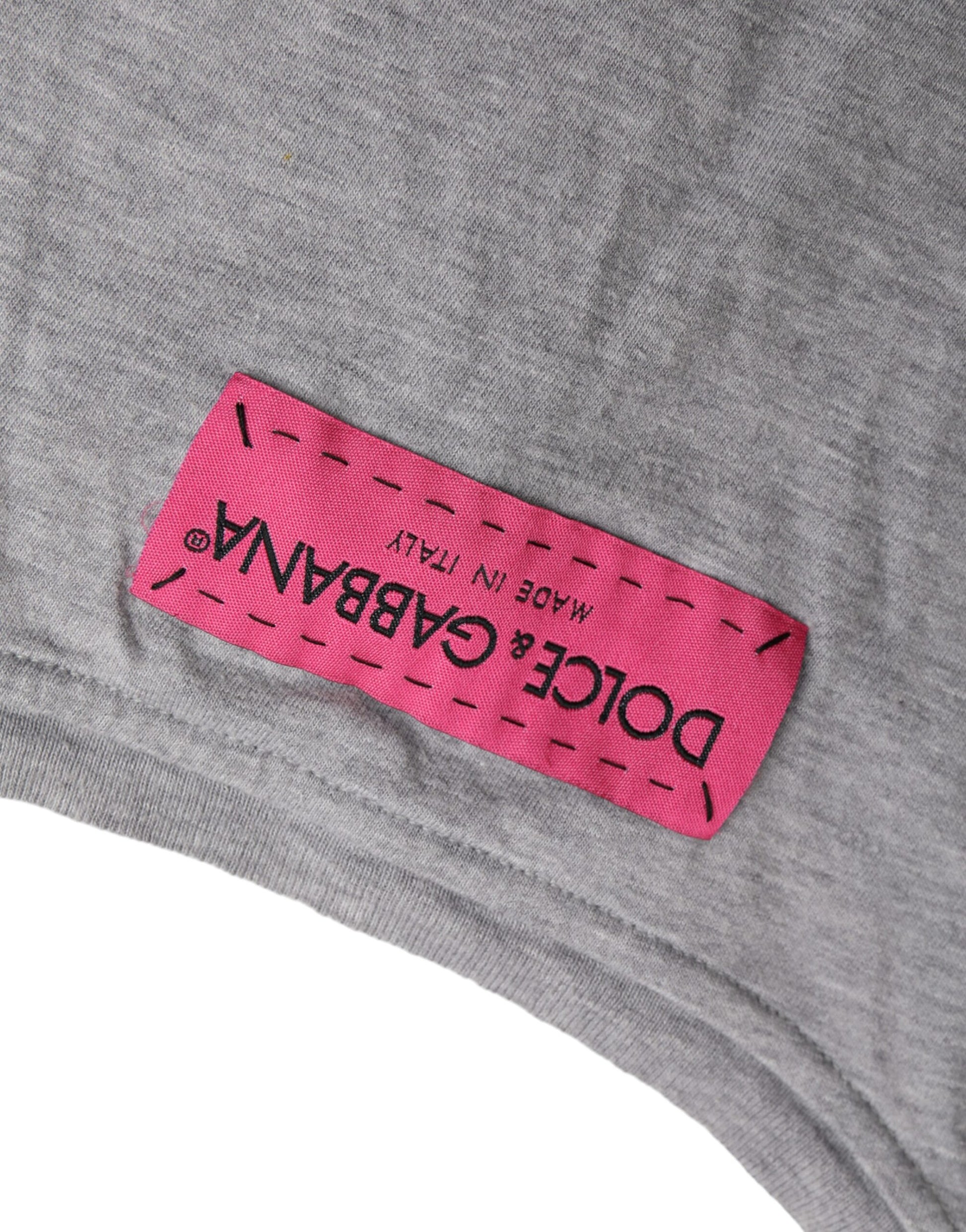 Pink label on gray shirt