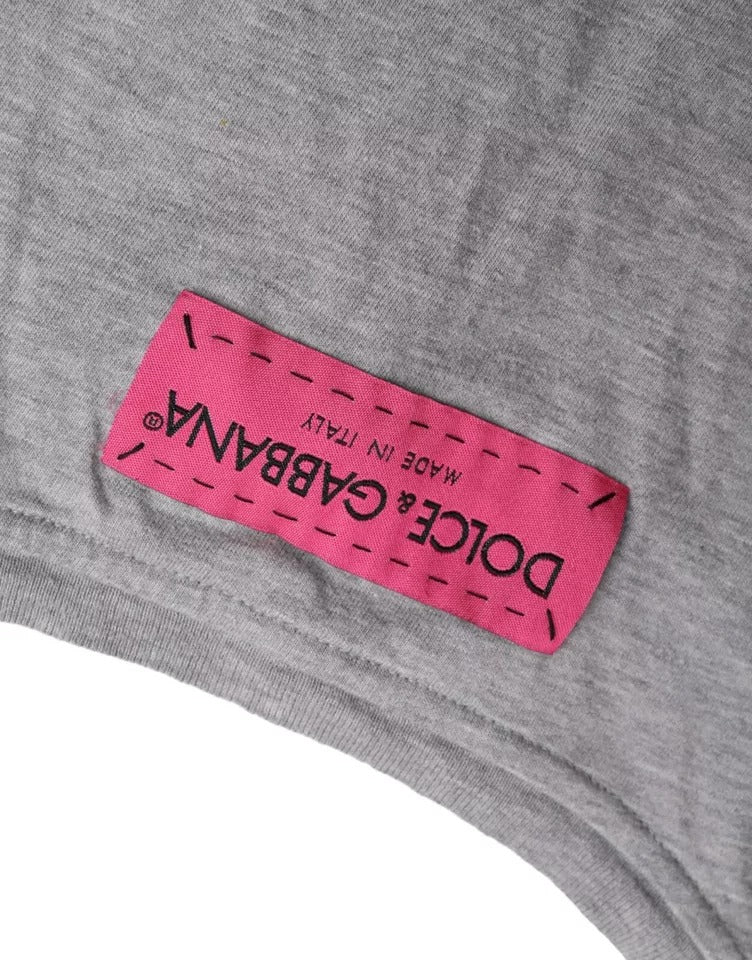 Pink tag on gray shirt