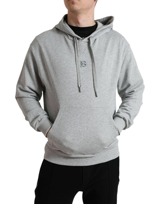 Man wearing a gray hoodie with stripes