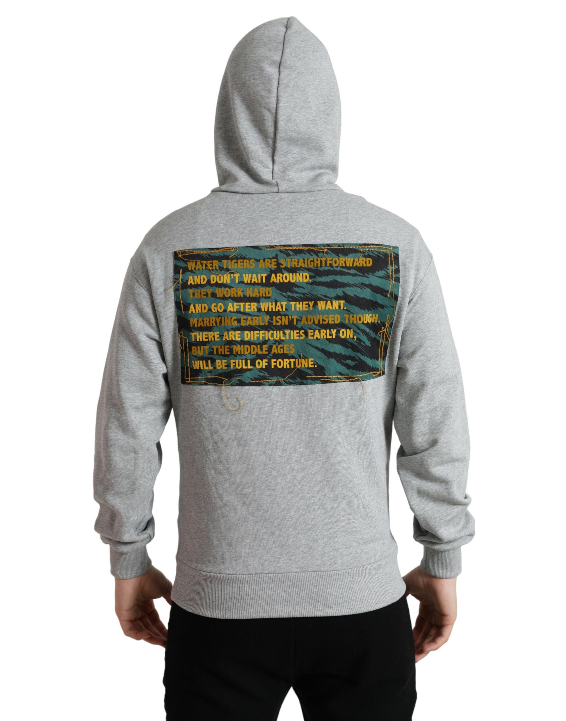 Grey hoodie with printed back design featuring a quote in yellow font on a camouflage background