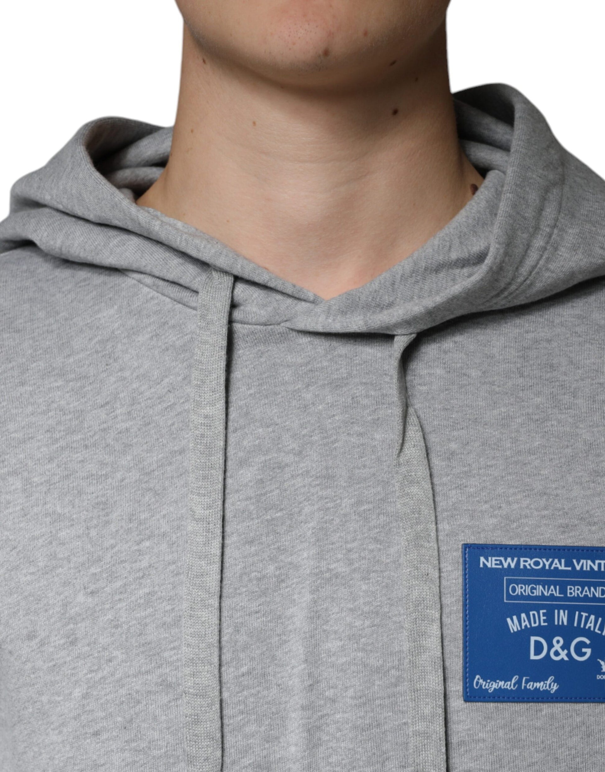 Grey hoodie with blue label on front