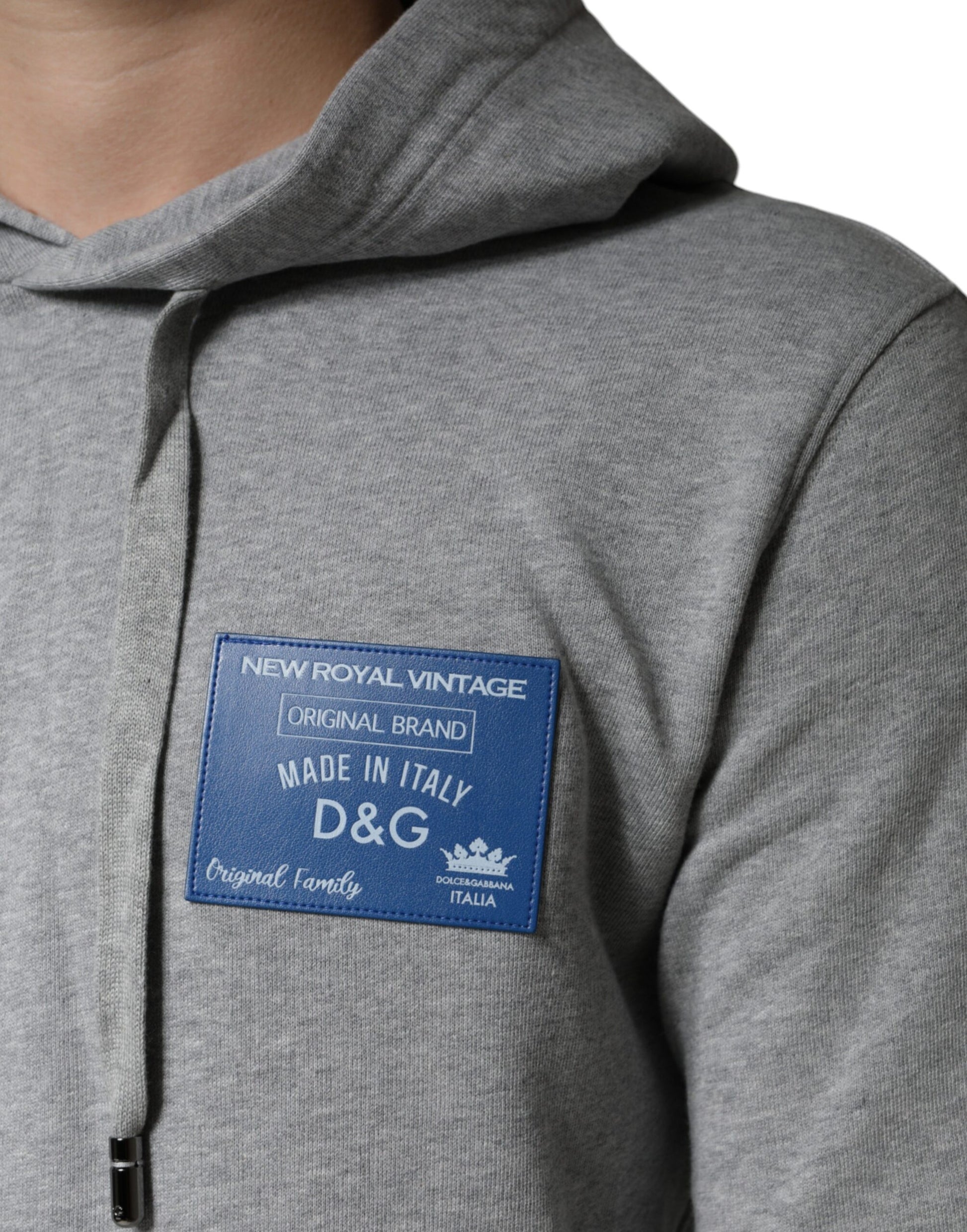 Grey hoodie with blue label on front