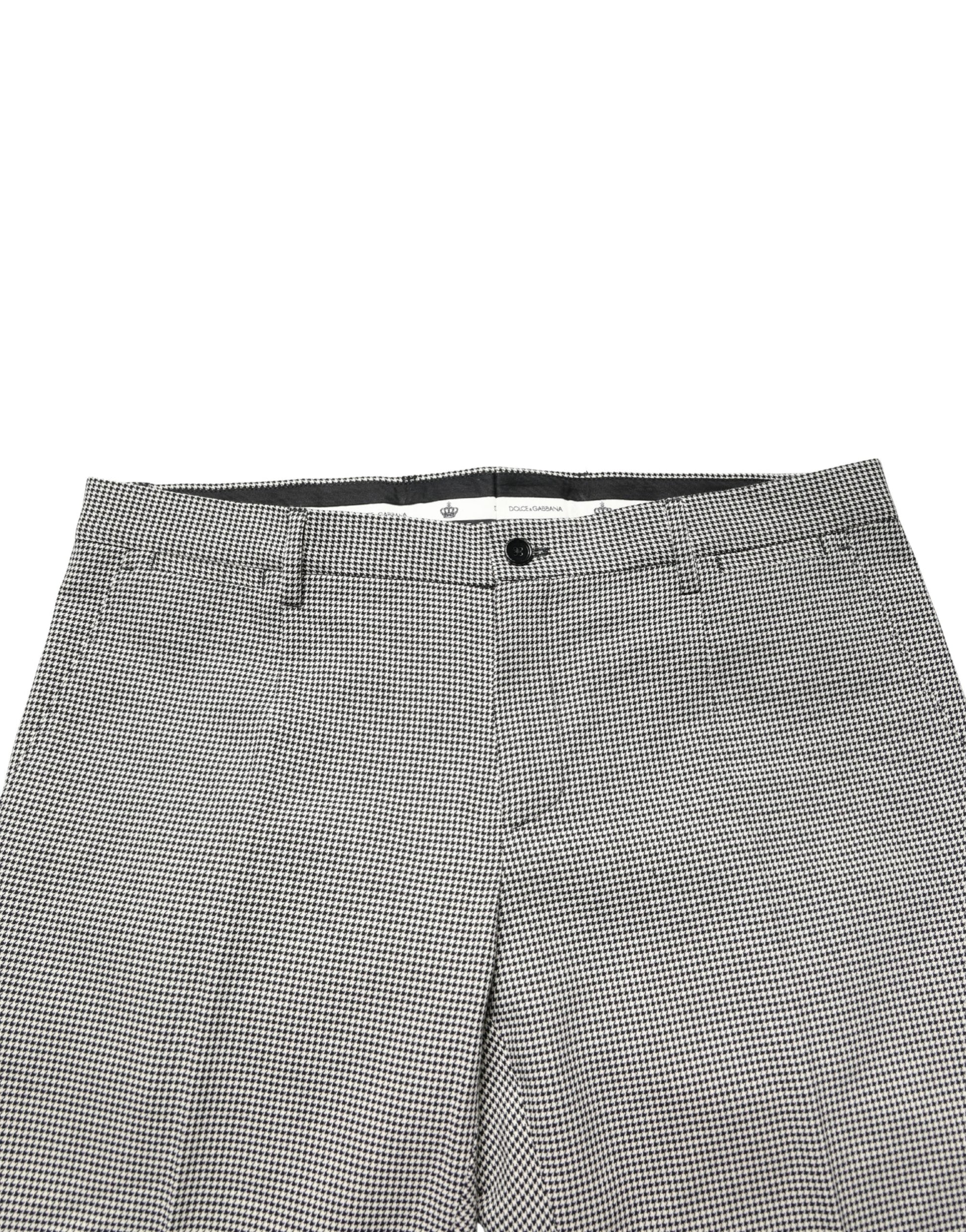 A pair of gray cotton skinny dress pants from the brand Dolce & Gabbana. They feature a checkered pattern and