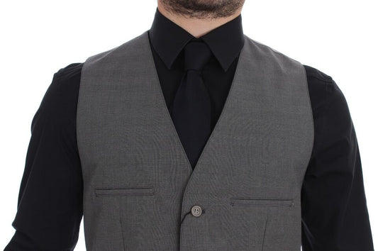A gray cotton vest with a button front, slim fit, and part of a suit