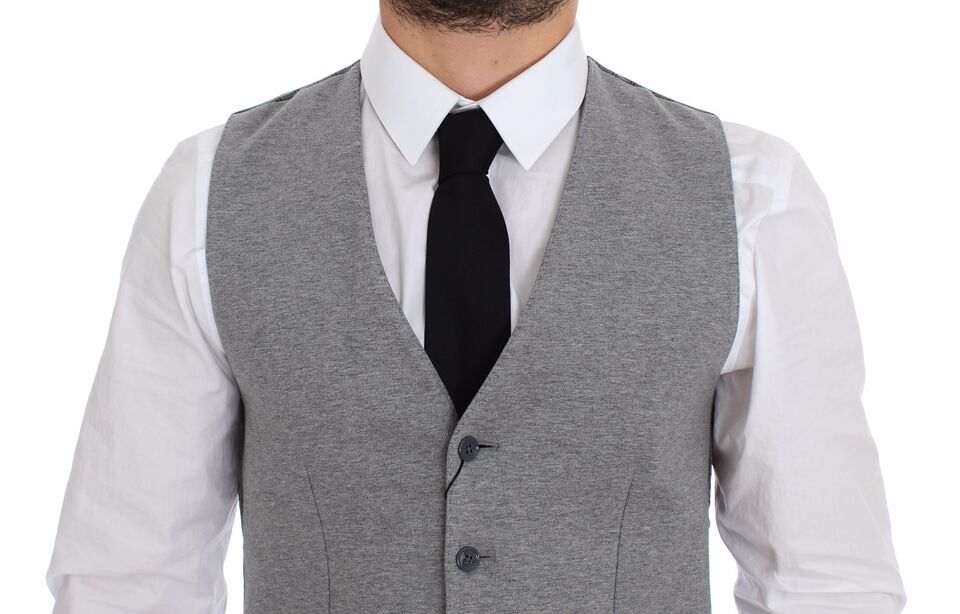 A gray cotton stretch vest blazer with black tie and white shirt