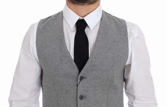 A gray cotton stretch vest blazer with black tie and white shirt