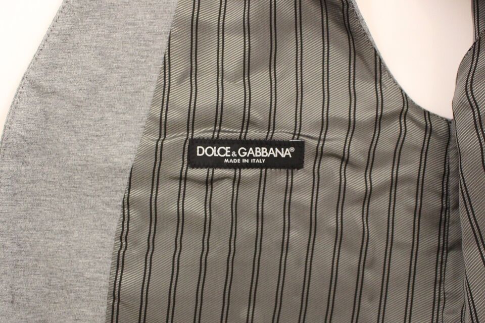 A gray cotton stretch vest with a black label that reads "Dolce & Gabbana"