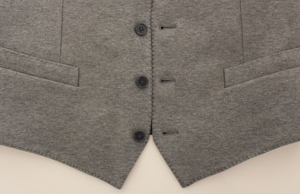A gray cotton stretch vest blazer with black buttons and a lapel collar