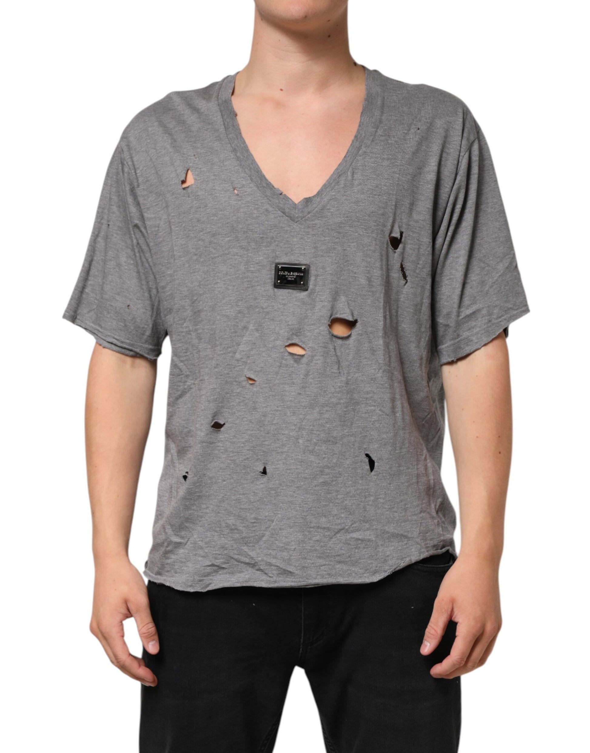 Man wearing gray shirt with holes in front