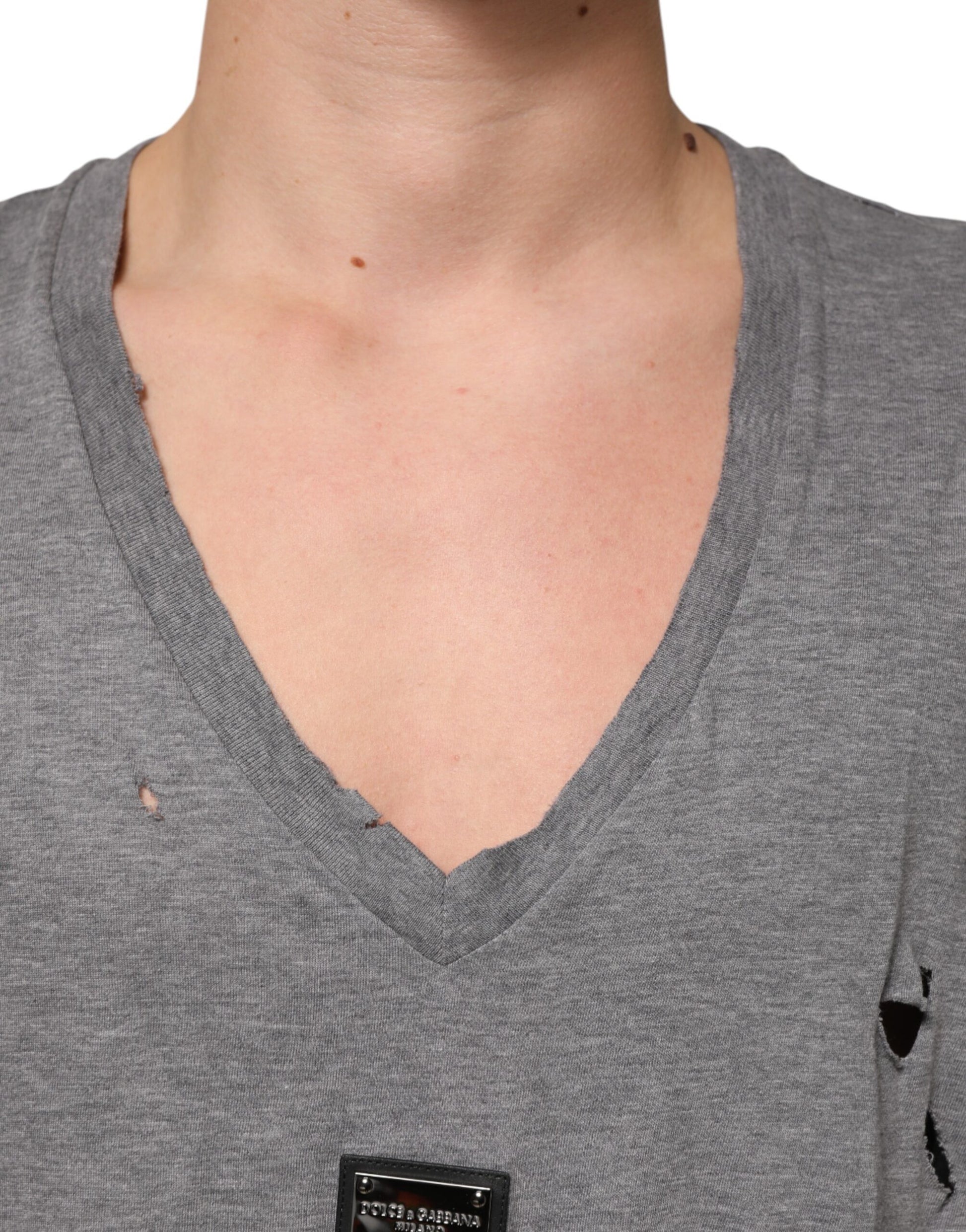 Grey v neck t-shirt with a hole in the front