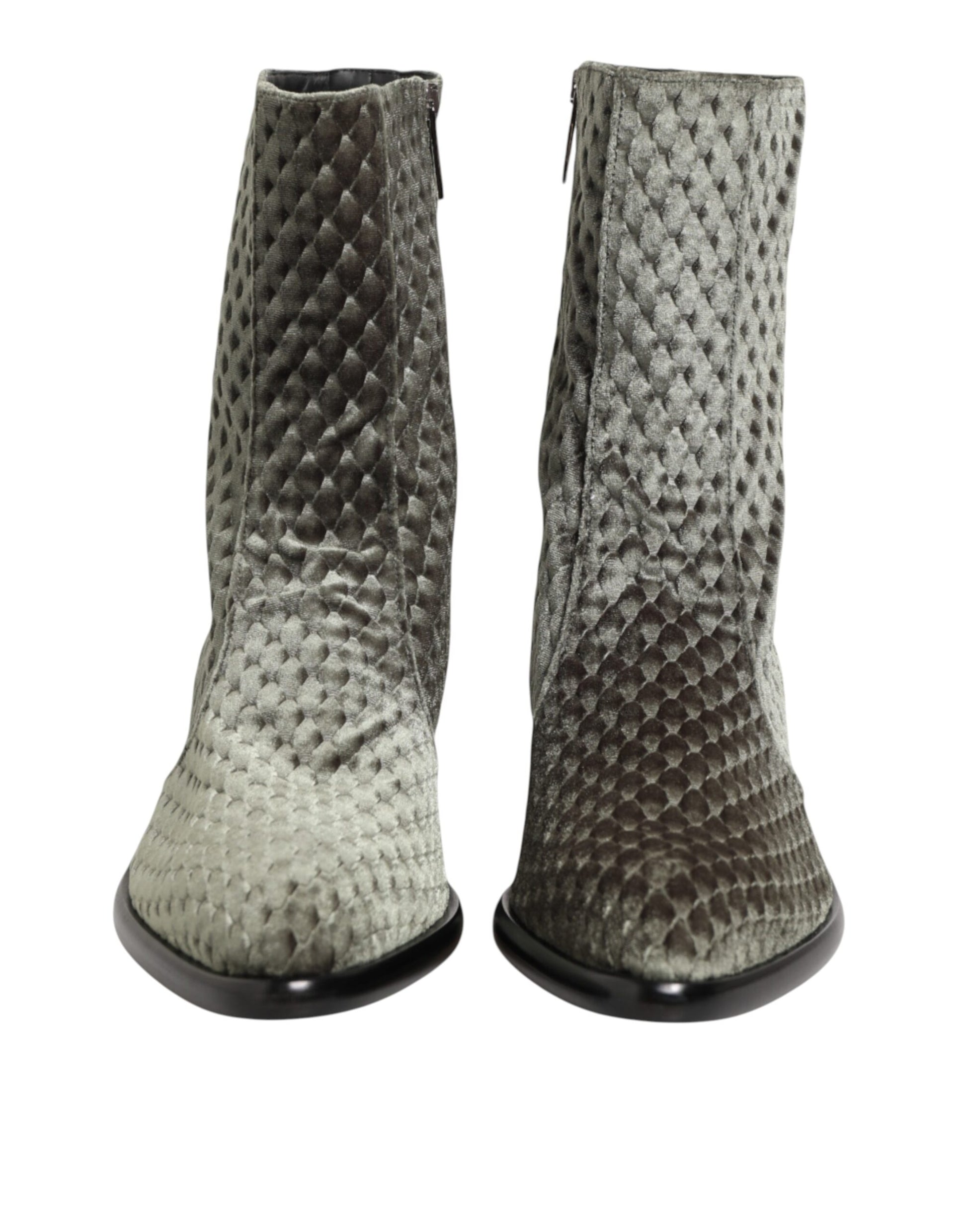 Pair of knee high boots with a snake skin texture design