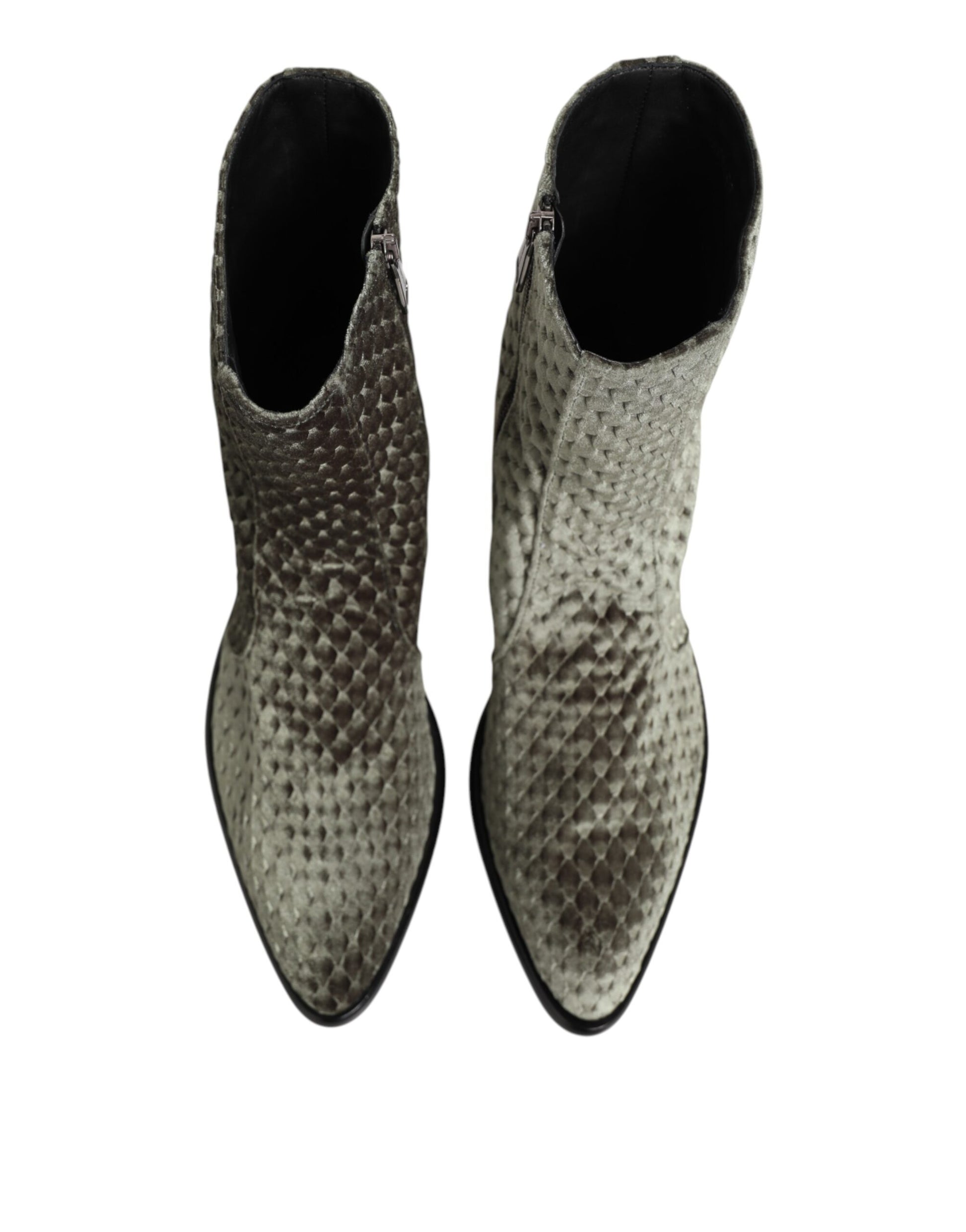 Pair of boots with a snake skin texture design