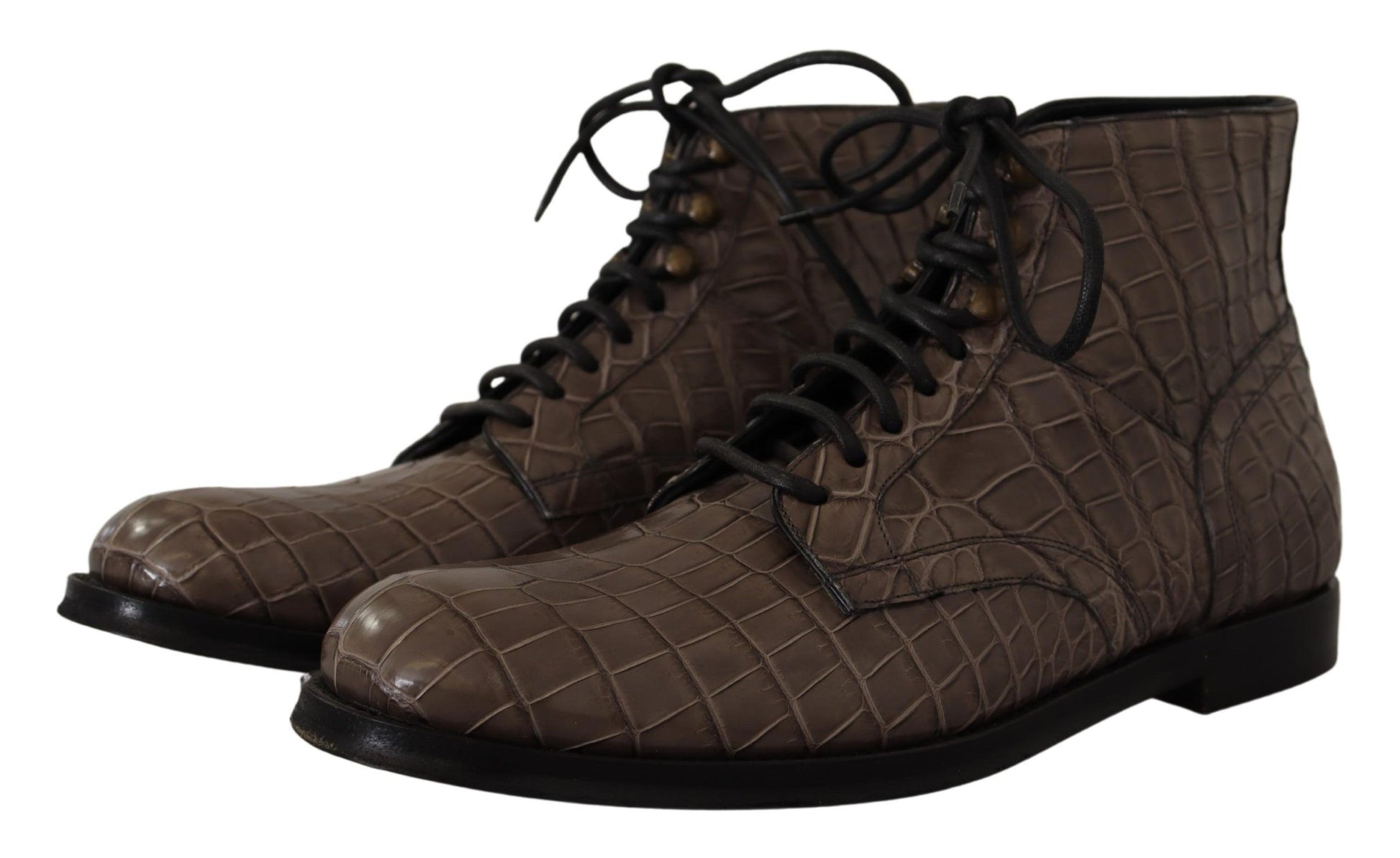 Pair of brown boots with laces and a crocodile skin texture design