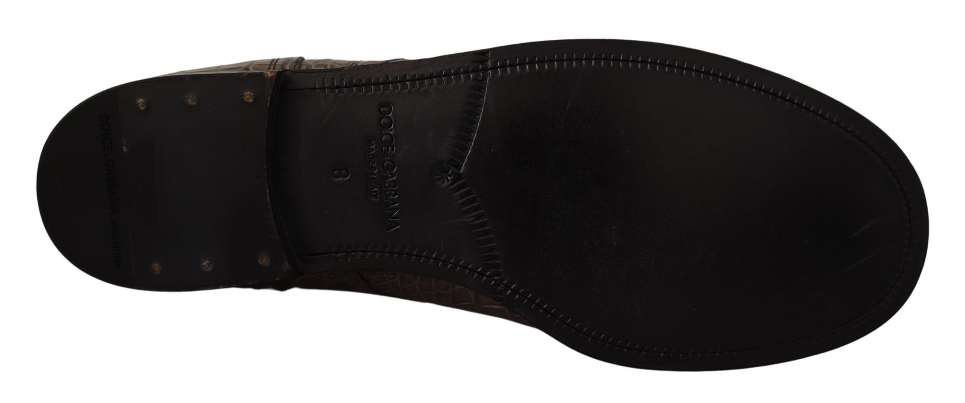 Black leather boot with metal studs and laces