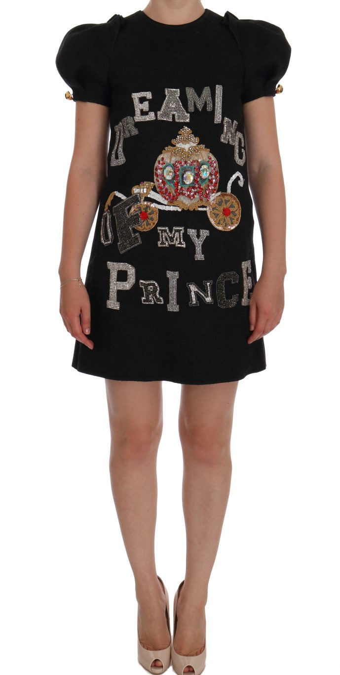 Black dress with "we're all mad here" written on front
