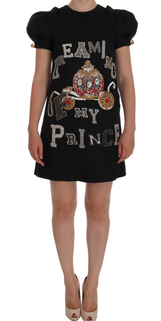 Black dress with "we're all mad here" written on front