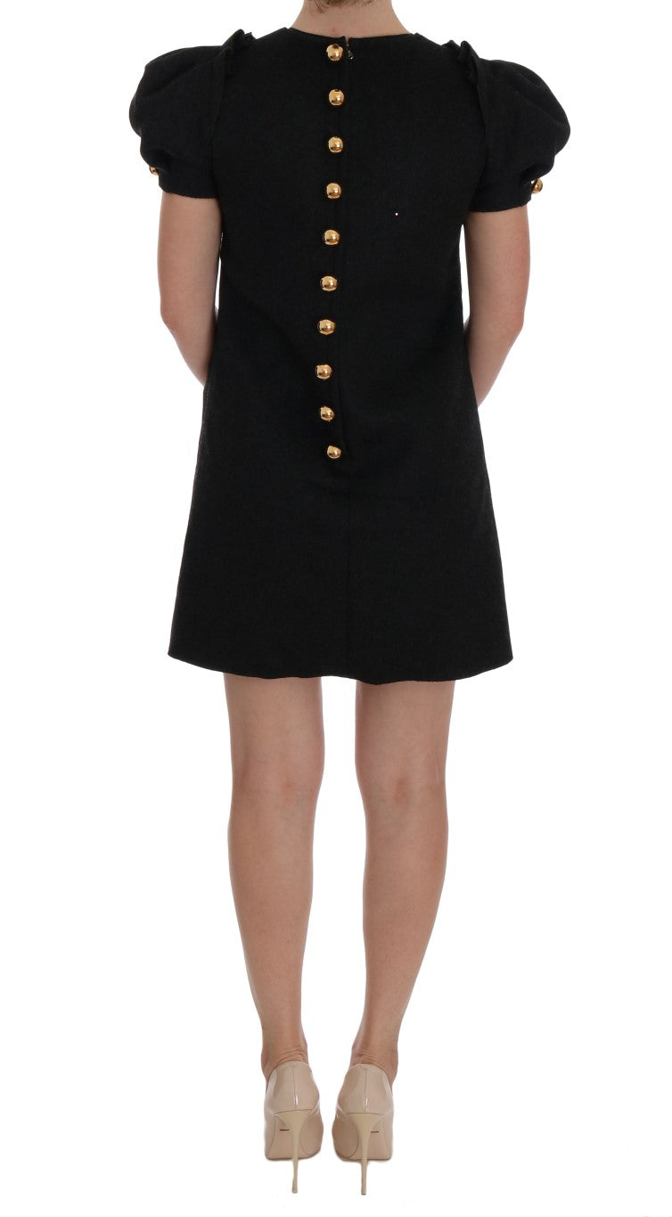 Black dress with gold buttons