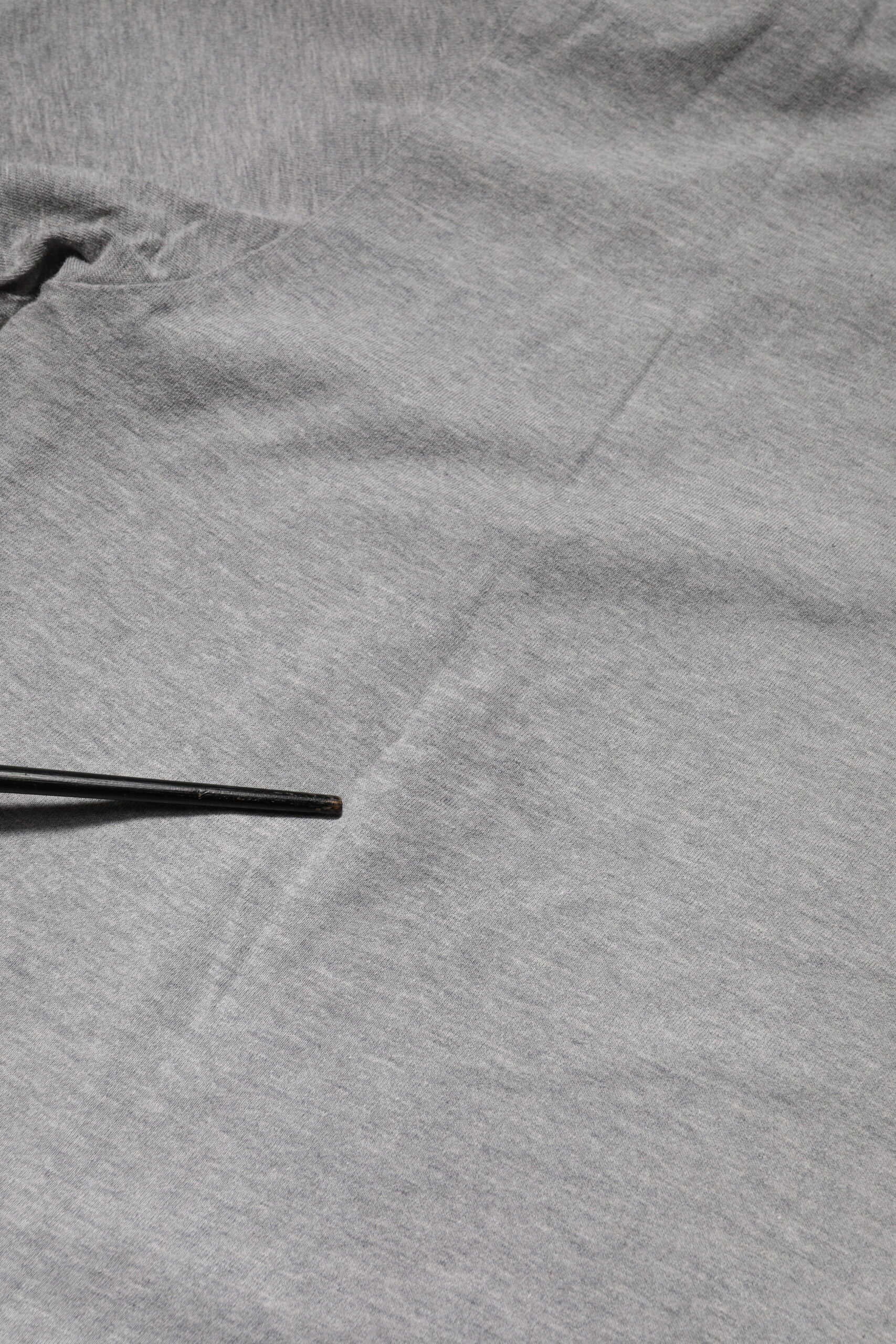 Grey fabric with wrinkles on surface