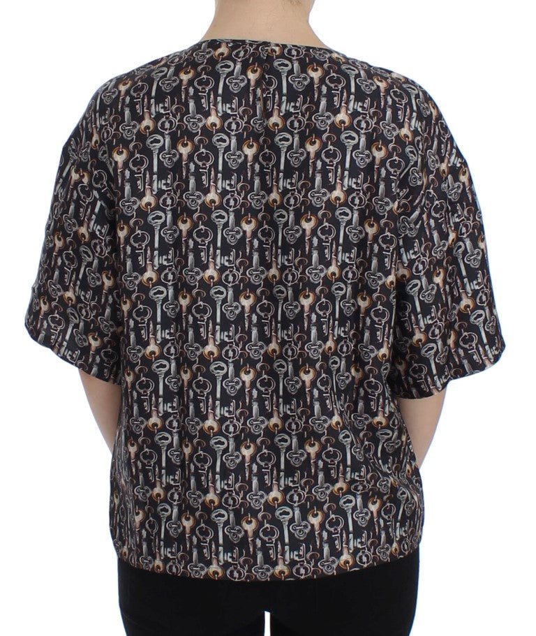 Black shirt with patterned back featuring multiple images of a person
