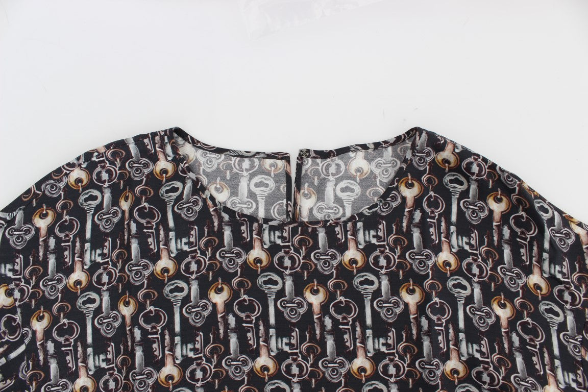 A garment with a pattern that includes various objects such as bottles, cups, and possibly other items. It ap