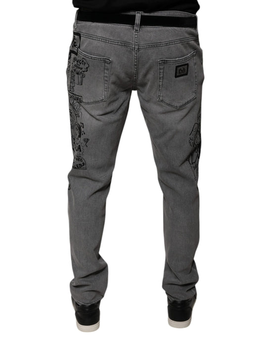 Pair of grey jeans with graphic design on legs