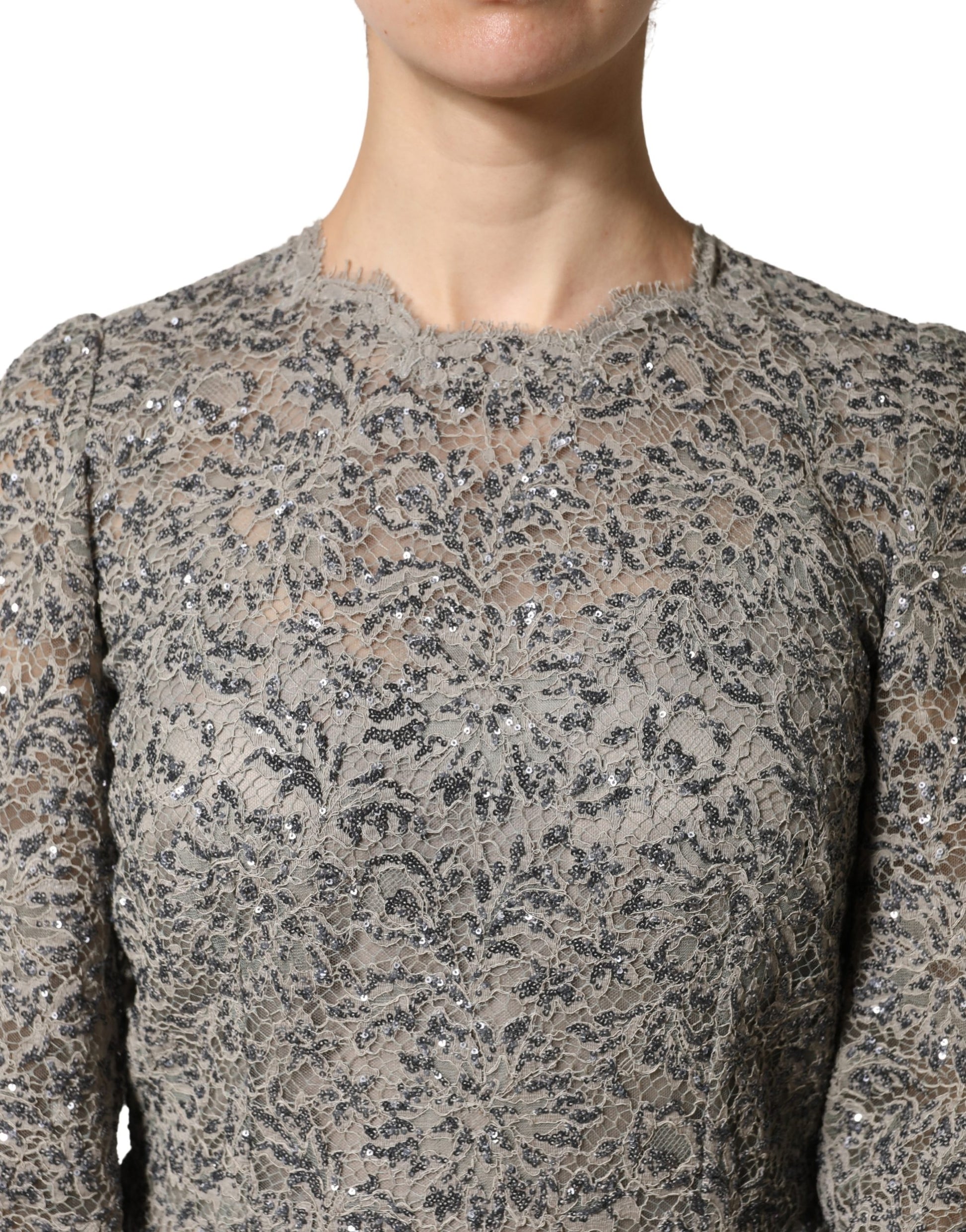 A gray lace long sleeve dress with a textured pattern