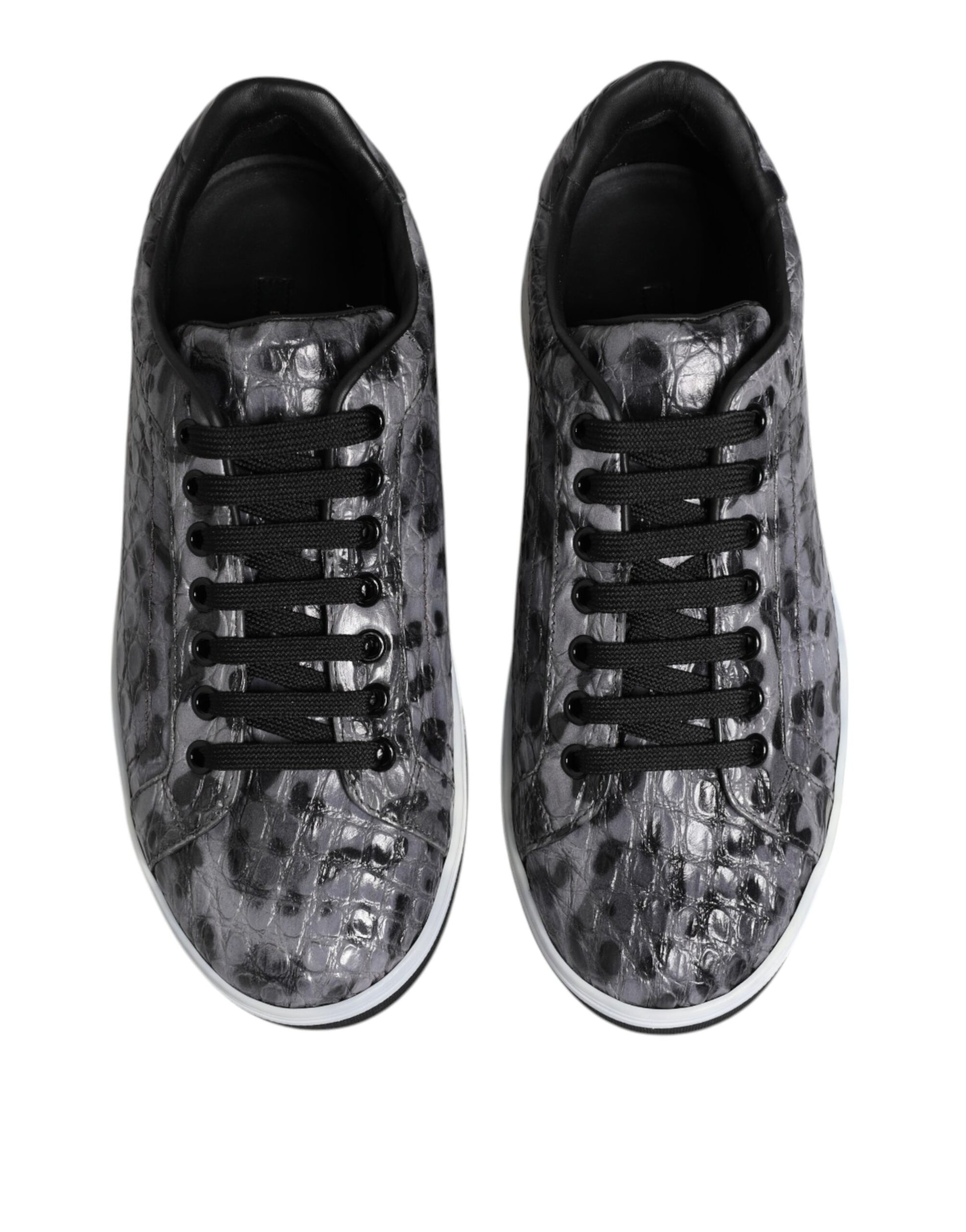 Pair of gray leopard print sneakers with black laces and white soles