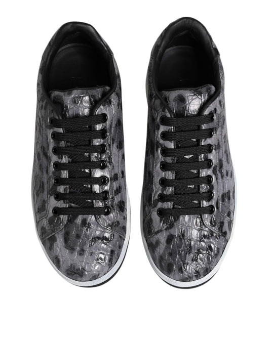 Pair of gray leopard print sneakers with black laces and white soles