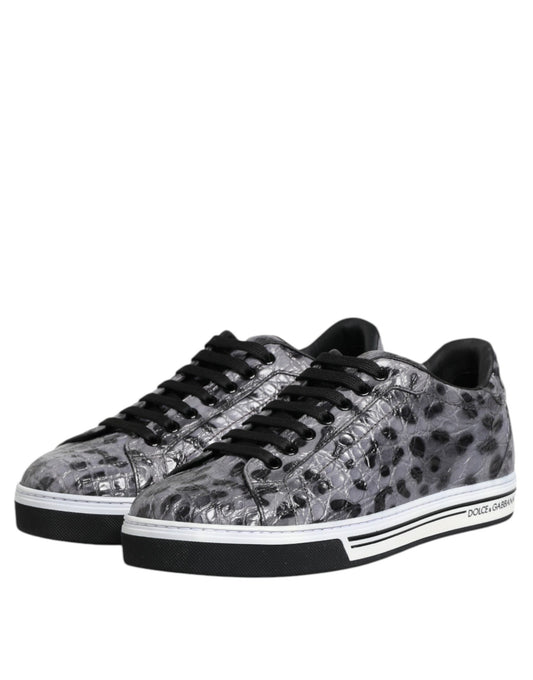Pair of gray leather sneakers with a leopard print pattern on the side