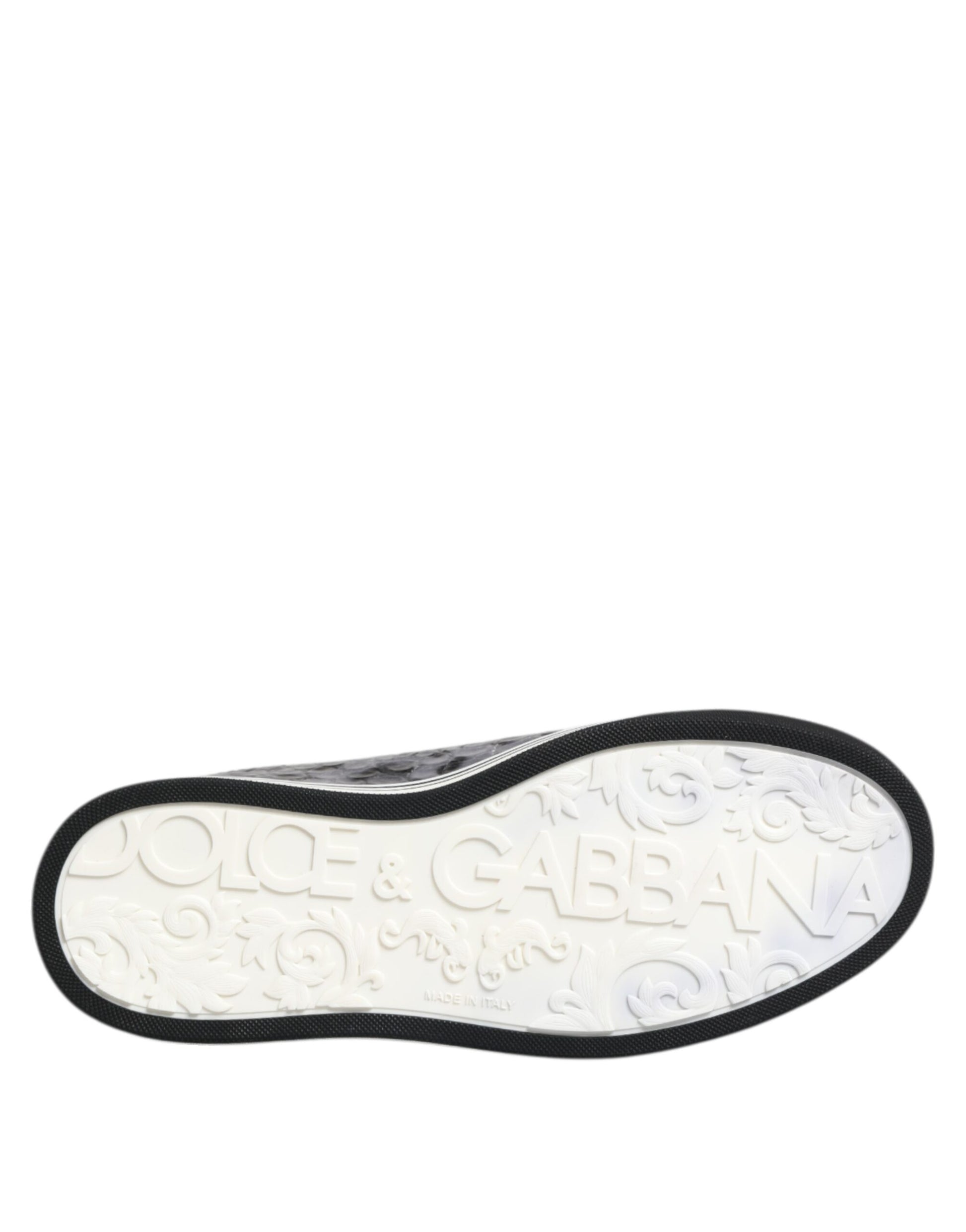 A single gray leather shoe with a black sole, featuring the brand name "Dolce & Gabbana" on the side