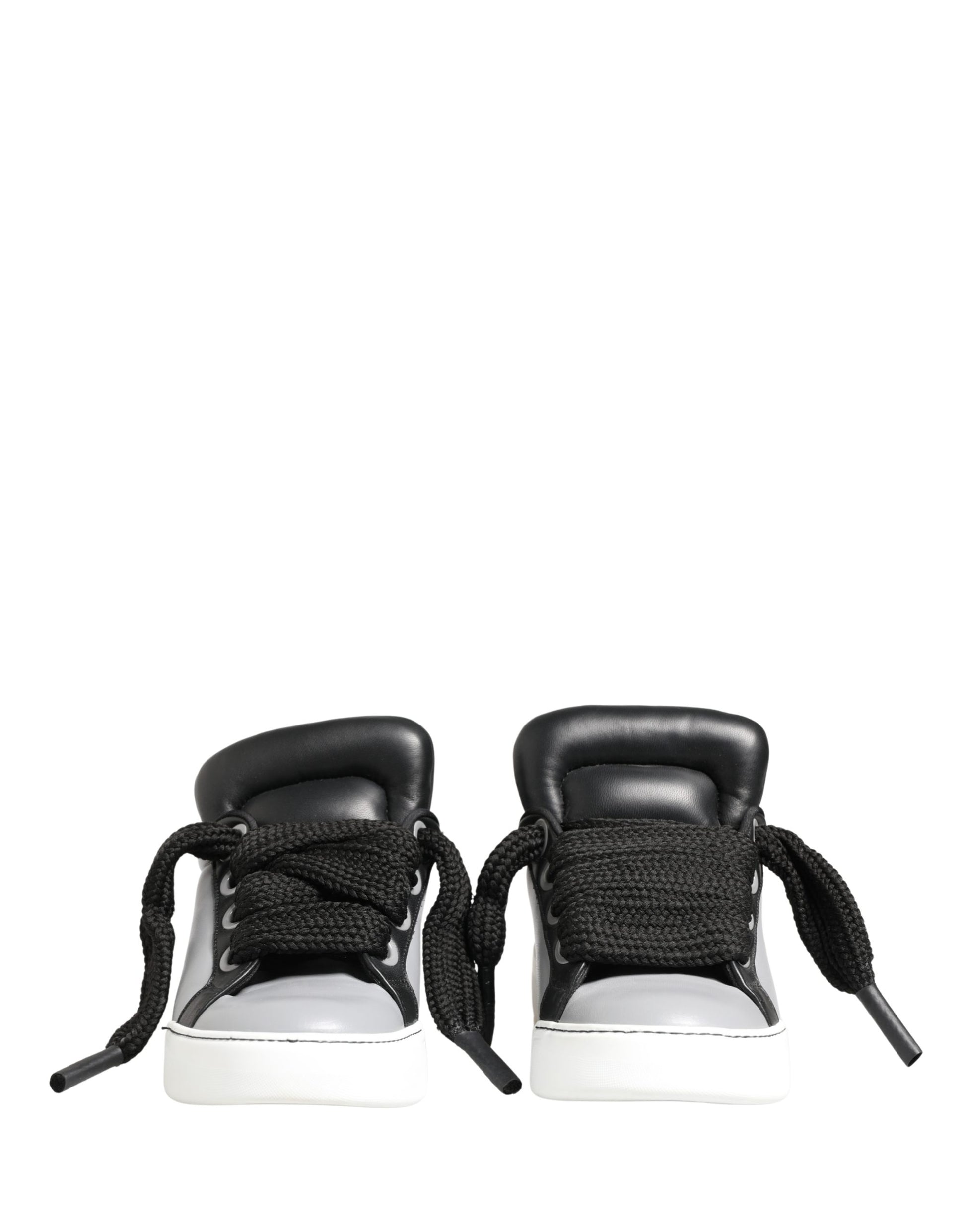 Black and white lace-up sneakers with black leather straps