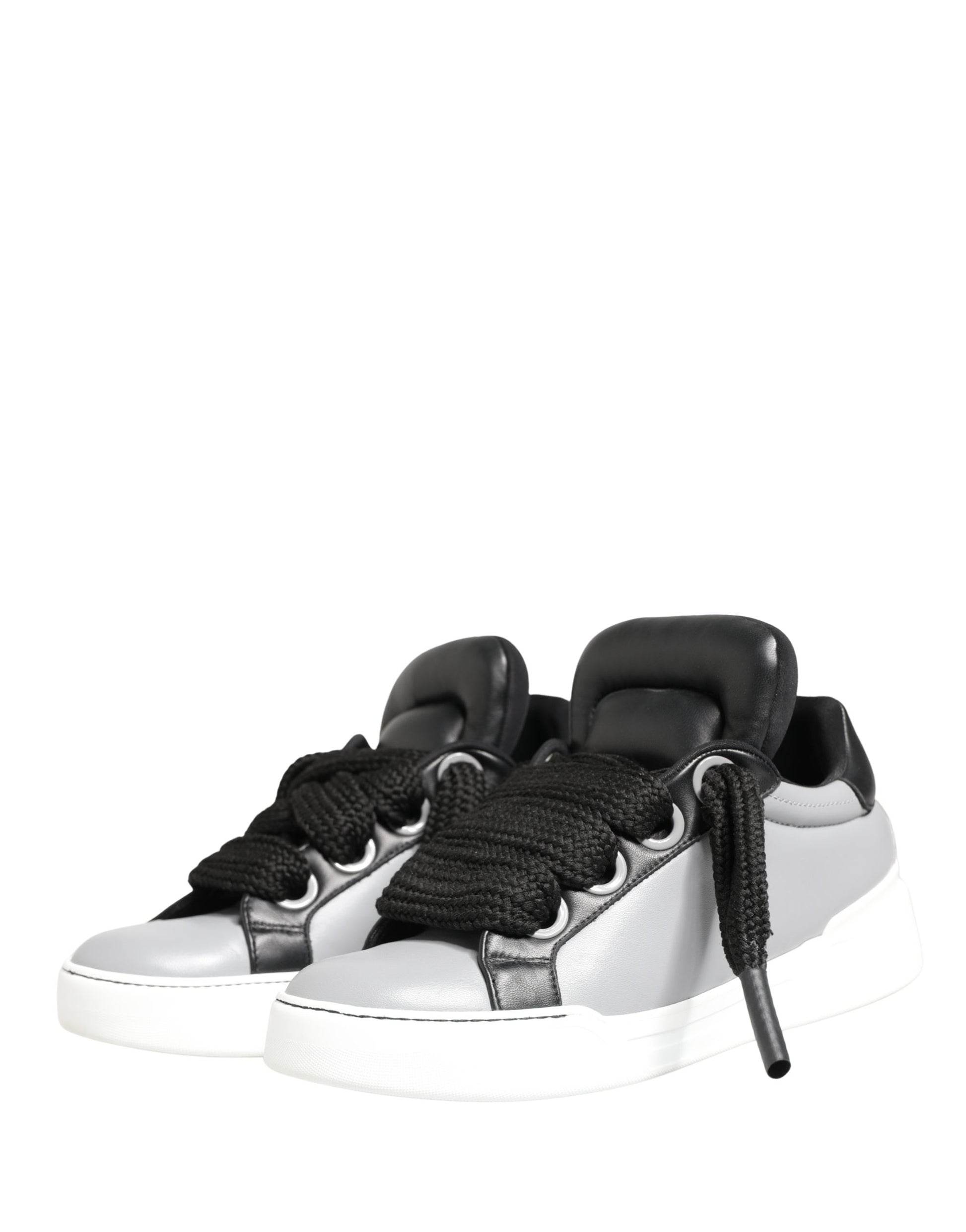 A pair of gray leather lace-up sneakers with black accents and a low top design
