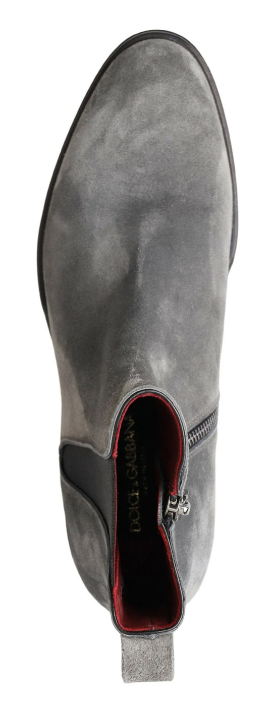 Pair of gray suede shoes with red lining and black laces