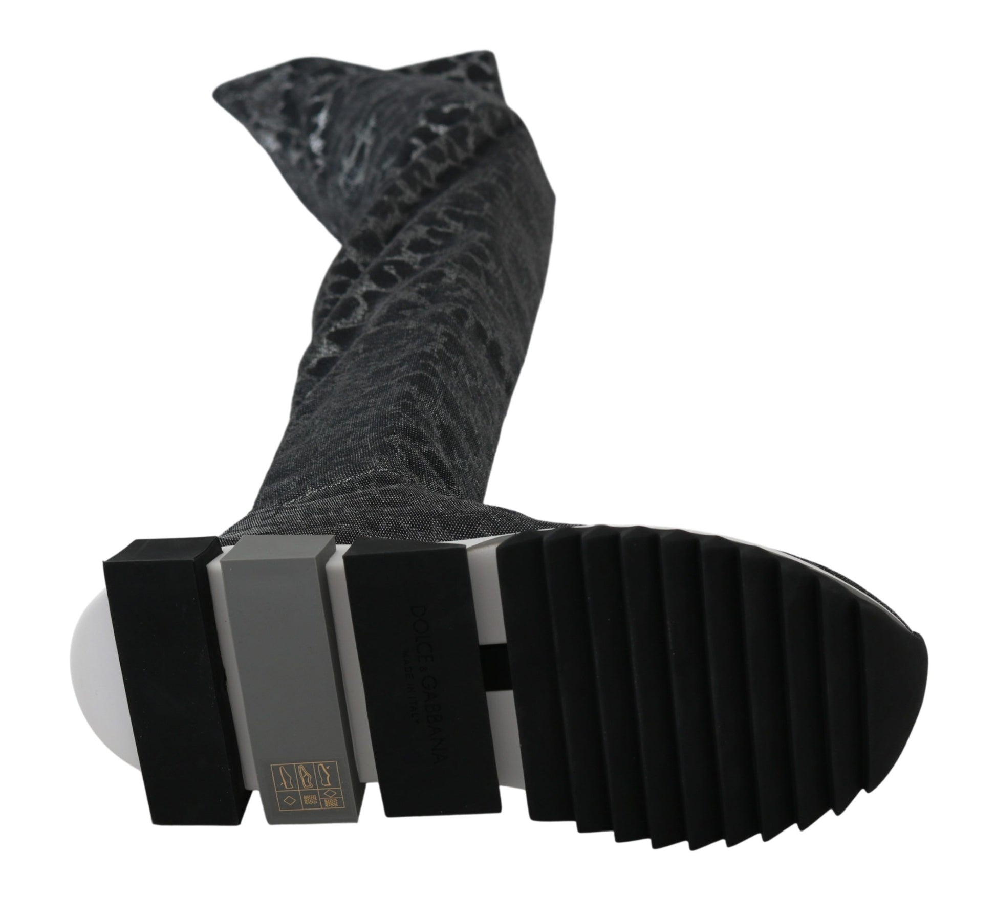 Black and white shoe with a patterned sock on top