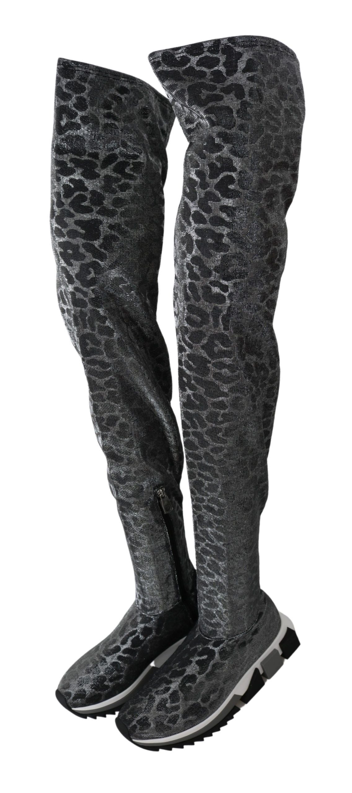 Pair of knee high boots with a camouflage pattern
