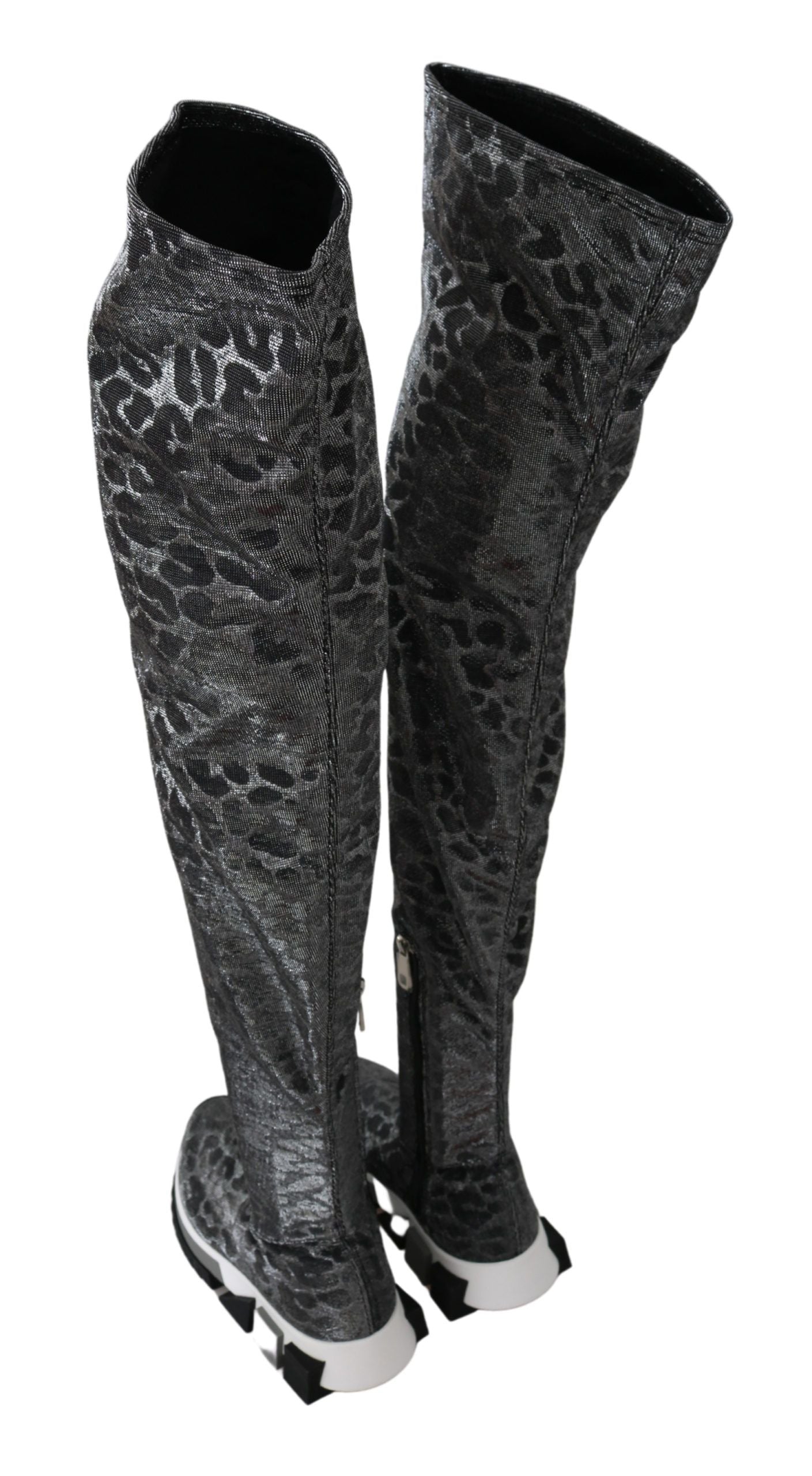 Pair of knee high boots with a patterned design